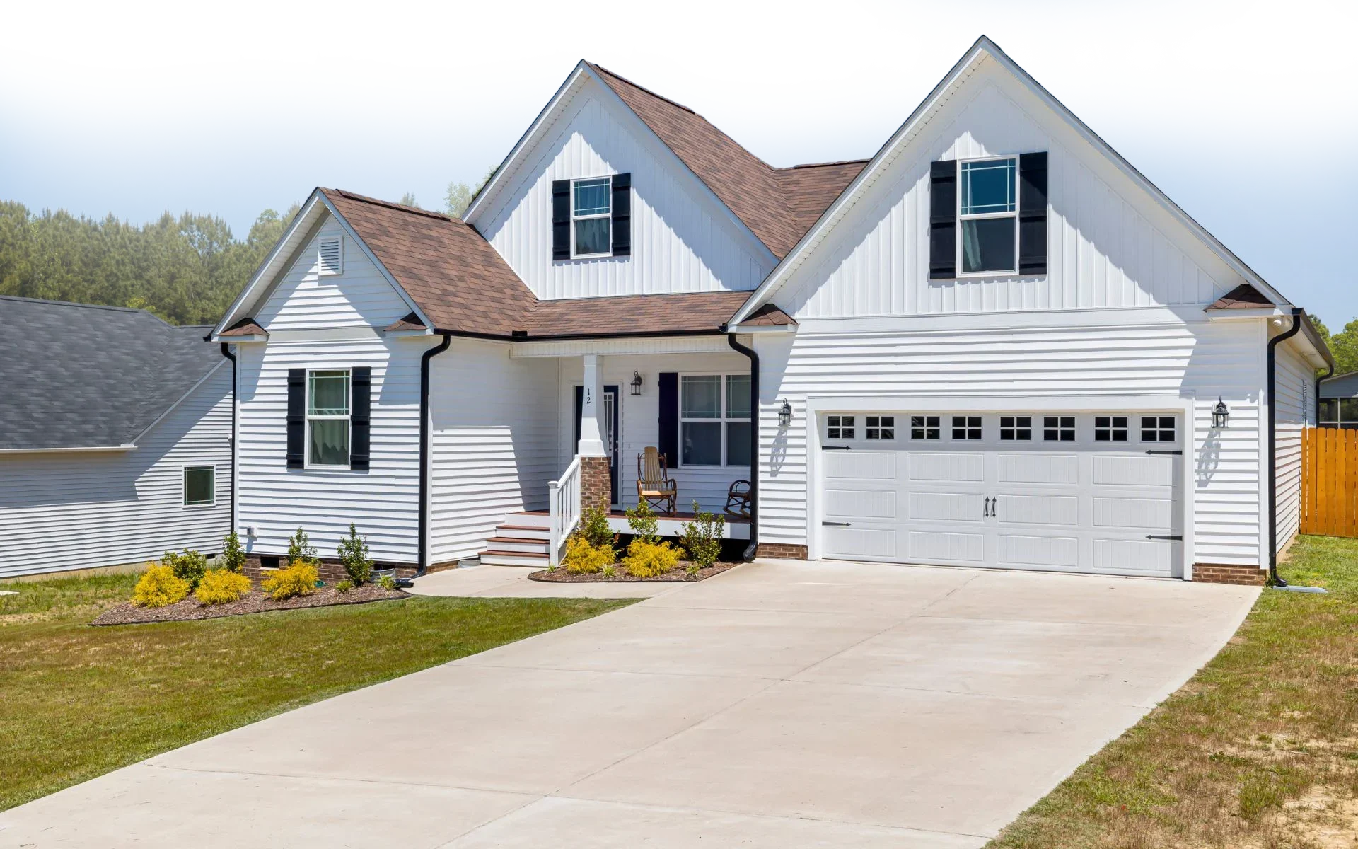 An Ontario home with new white siding installation