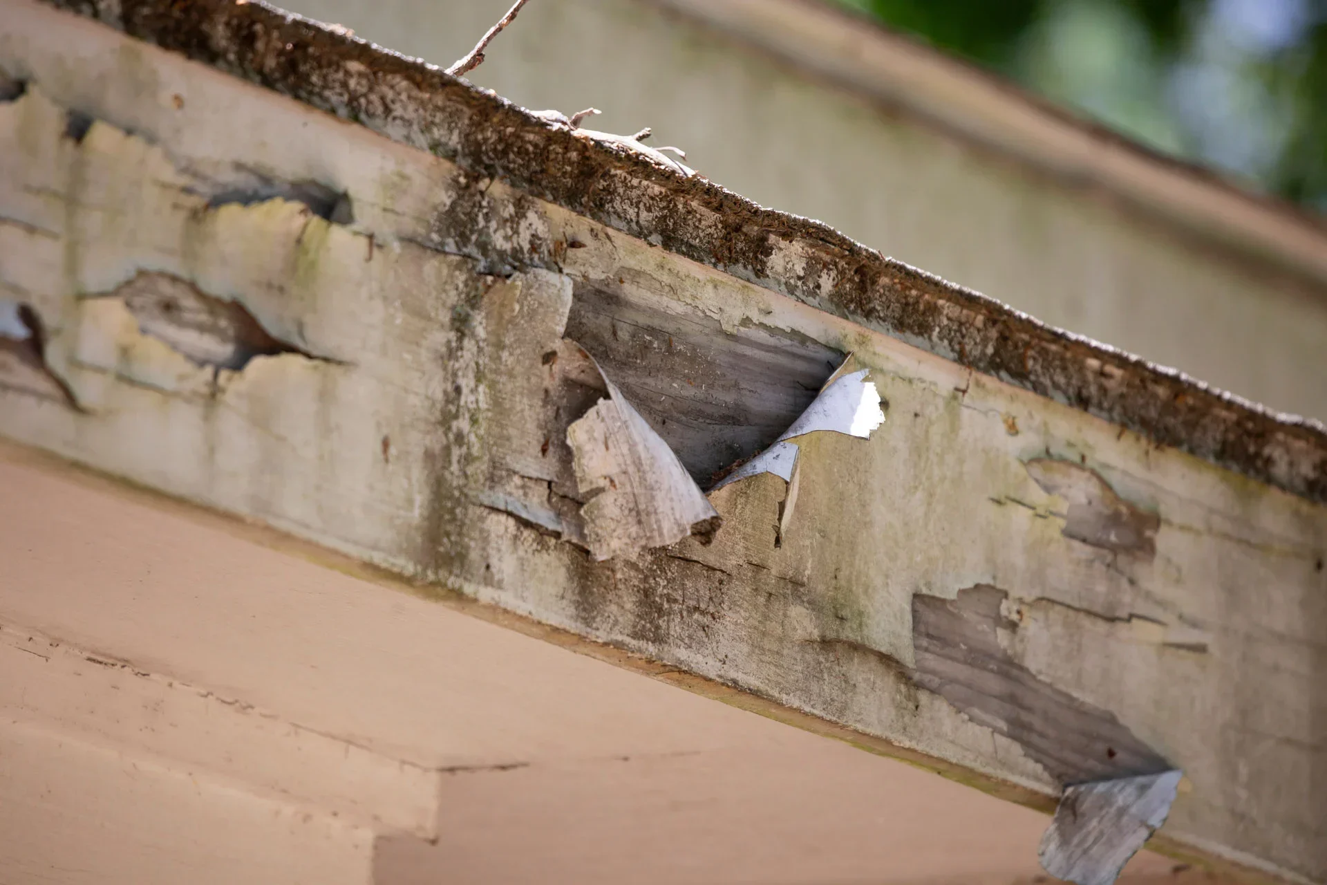 Old fascia that is rotting and falling apart