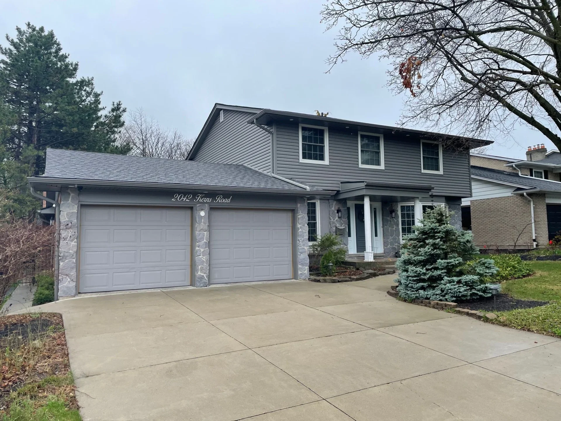 A new grey home with fascia and soffit replacement, part of The Eavestrough Company's exterior home renovation gallery