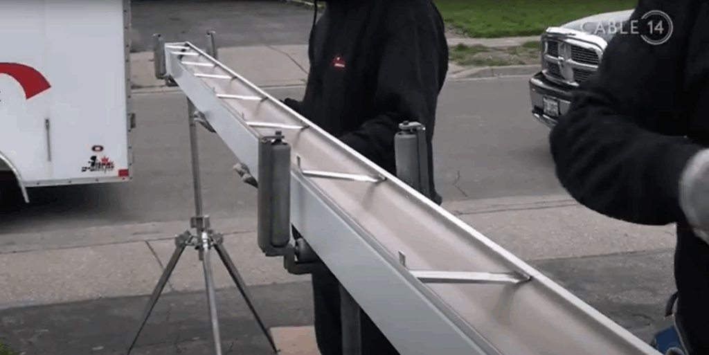 Closeup of installing hangers on an eavestrough piece